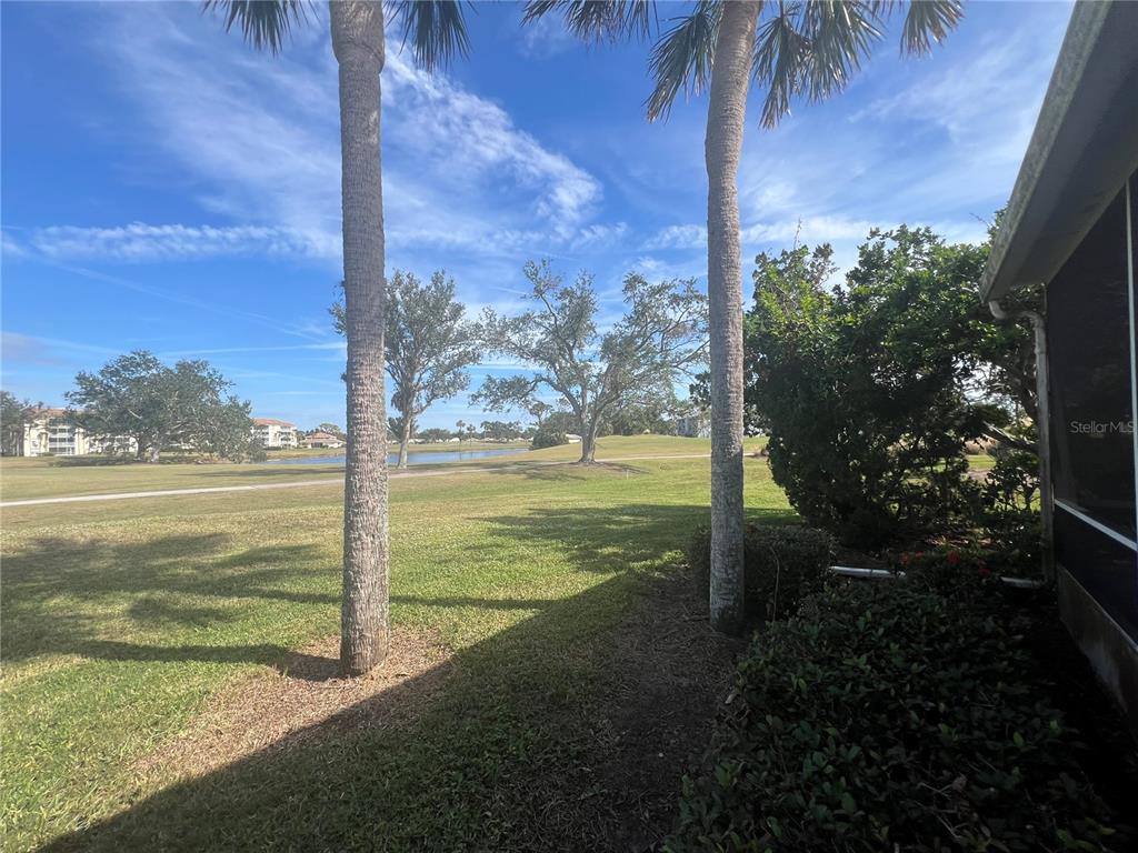 338 Cerromar Way, Unit 4 Venice, FL 34293 - Photo 39 of 41 a view of a yard with an outdoor space