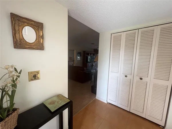 a dining room with furniture and a book shelf