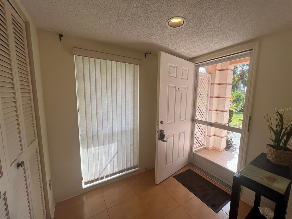338 Cerromar Way, Unit 4 Venice, FL 34293 - Photo 6 of 41 a view of an empty room and window
