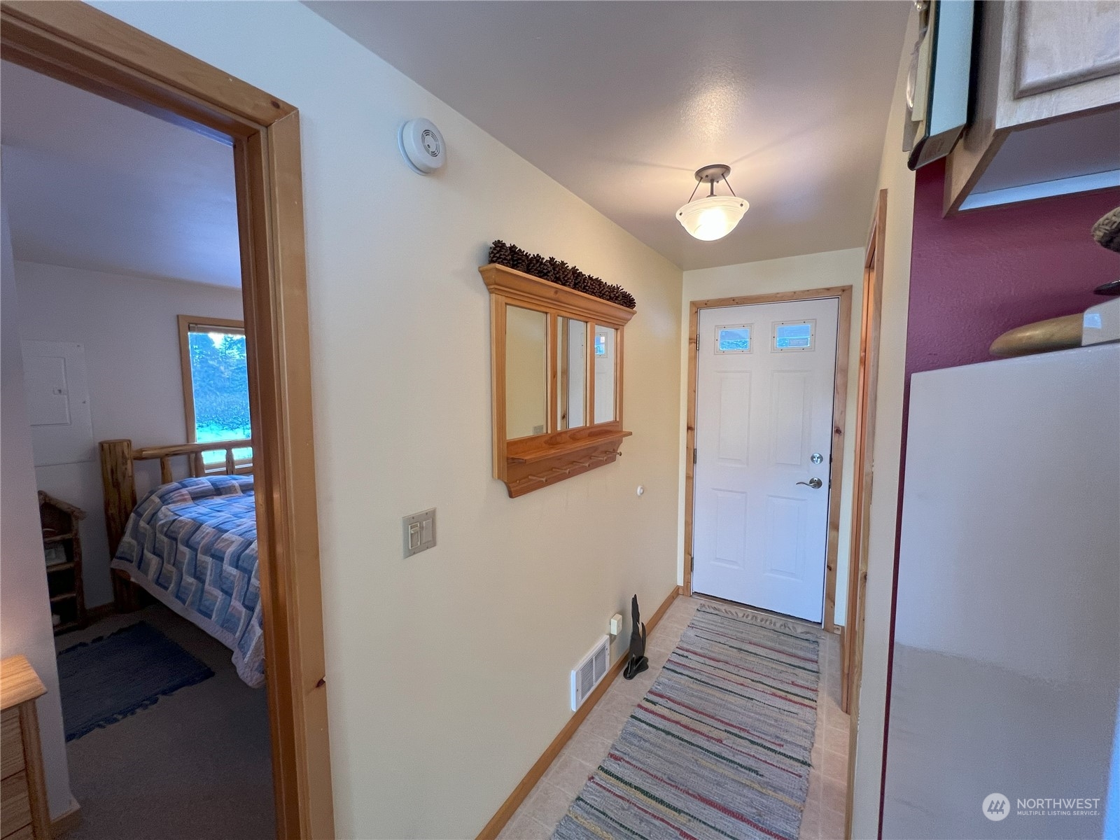 30 Left Fork Wolf Creek Road Winthrop, WA 98862 - Photo 13 of 40 a view of a hallway with bedroom and wooden floor