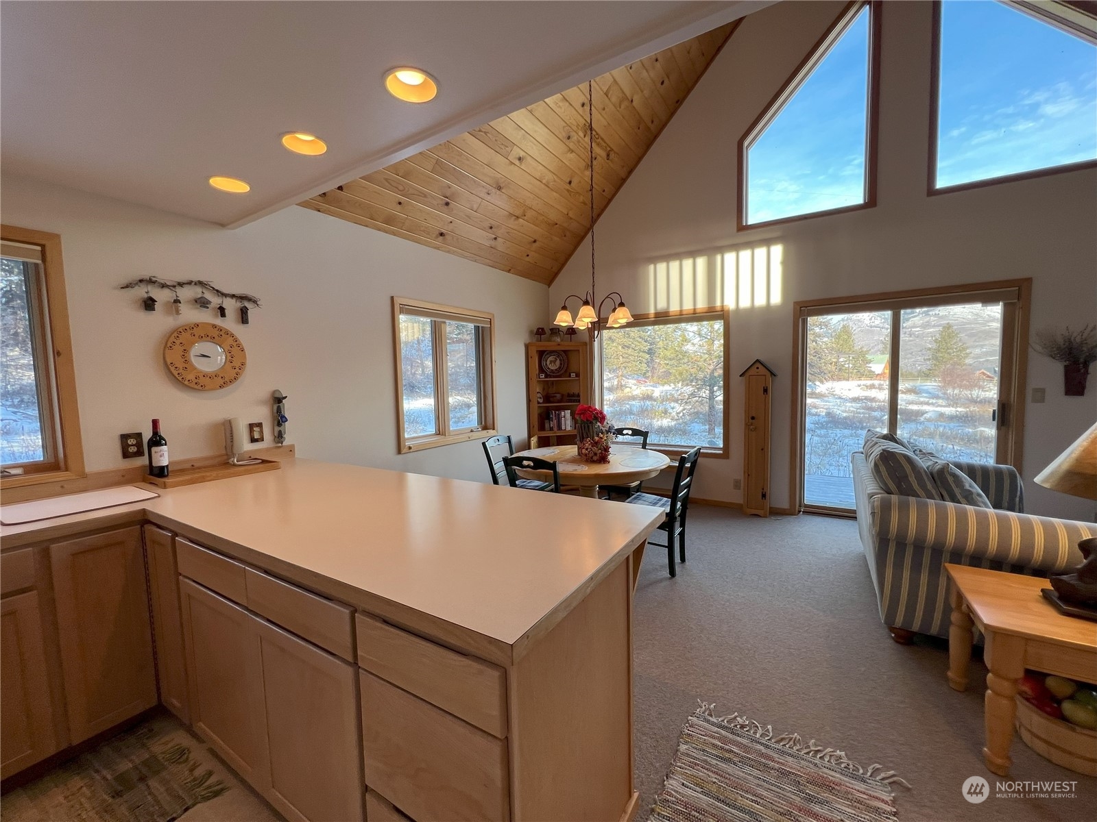 30 Left Fork Wolf Creek Road Winthrop, WA 98862 - Photo 17 of 40 a living room with stainless steel appliances furniture a rug and a large window