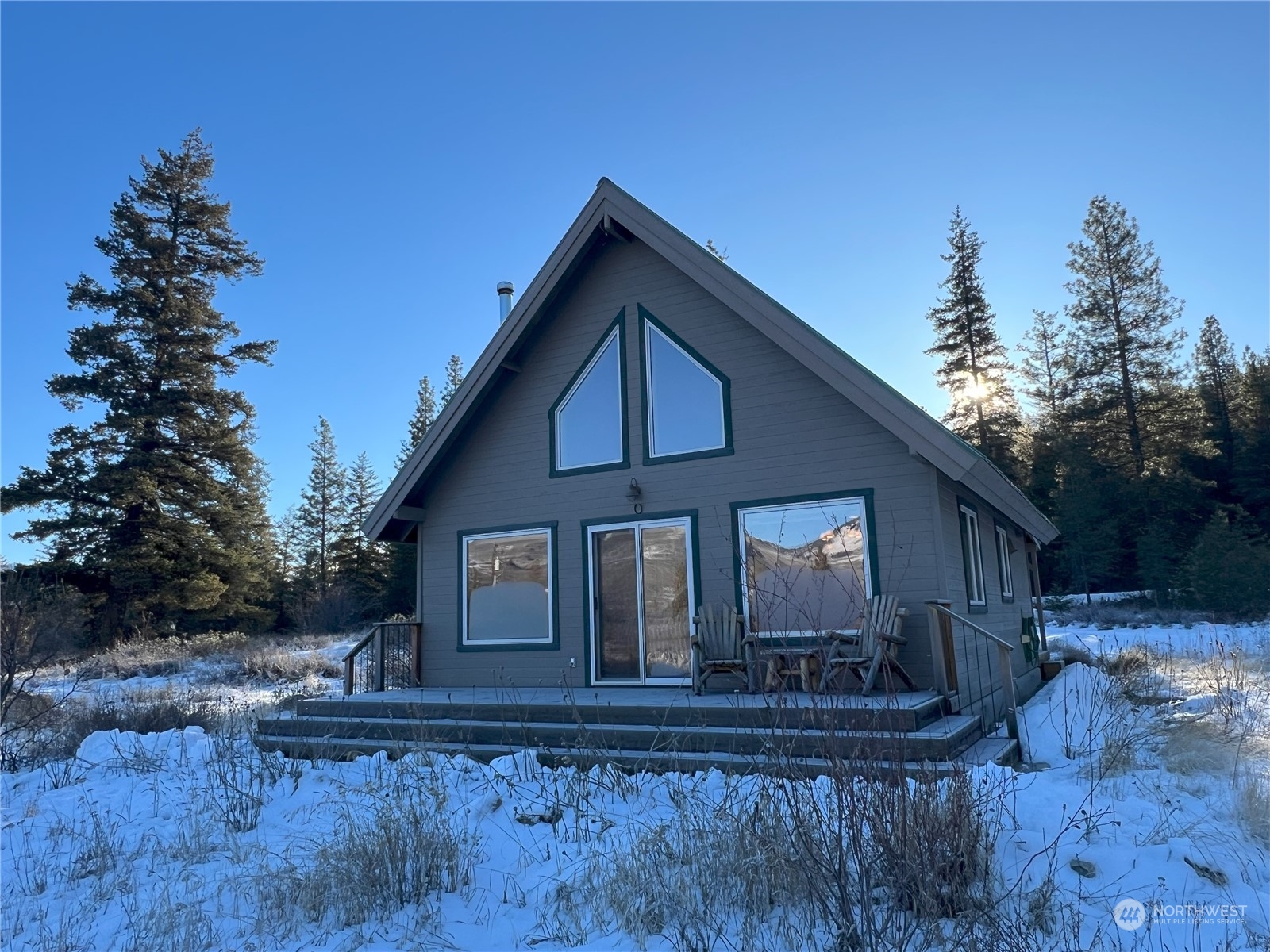 30 Left Fork Wolf Creek Road Winthrop, WA 98862 - Photo 2 of 40 a front view of a house with garden