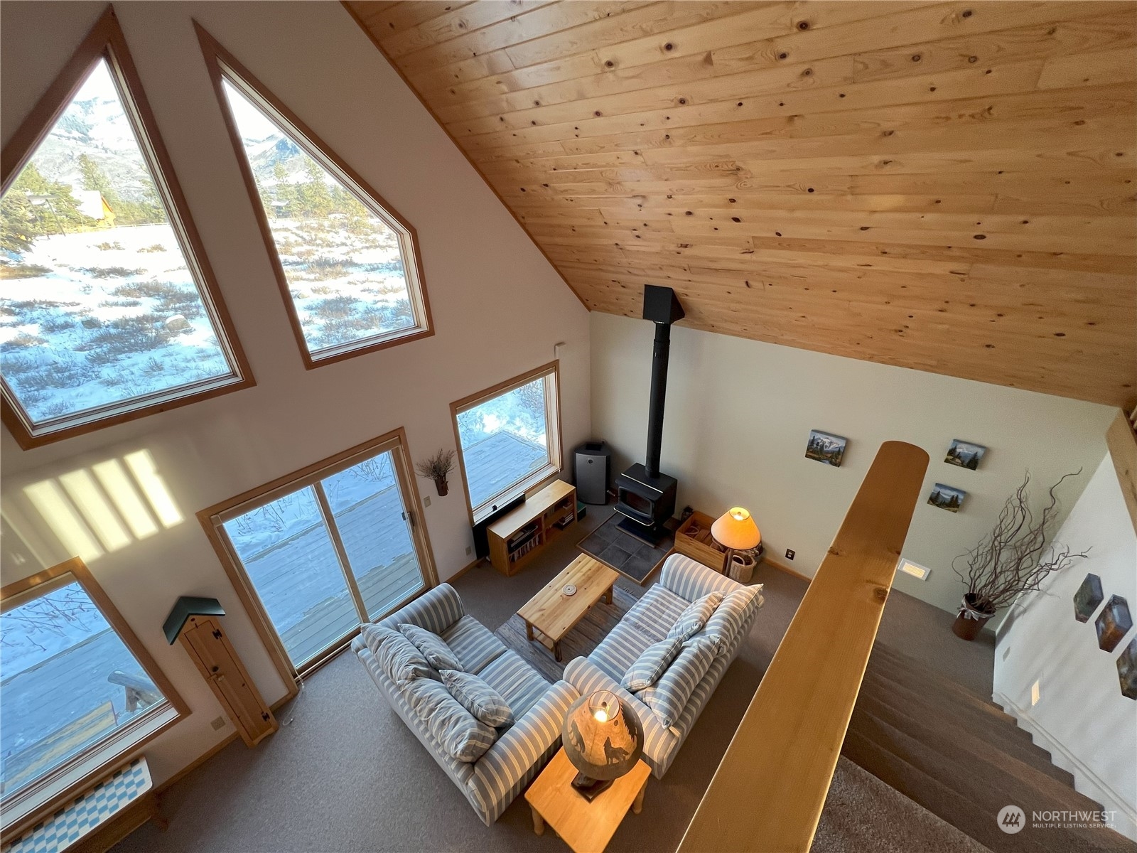 30 Left Fork Wolf Creek Road Winthrop, WA 98862 - Photo 25 of 40 a view of workspace with wooden floor windows and book shelf