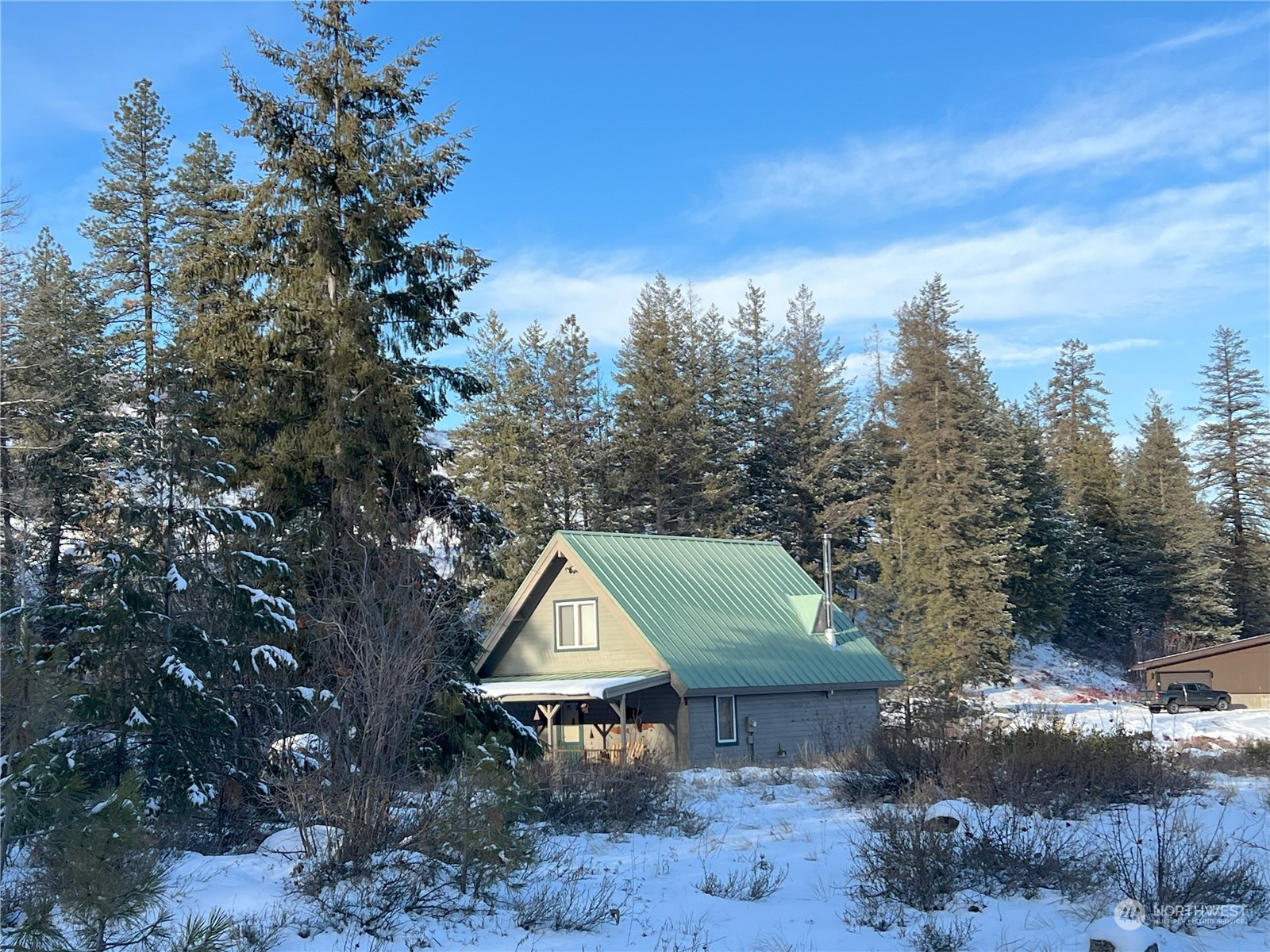 30 Left Fork Wolf Creek Road Winthrop, WA 98862 - Photo 27 of 40 a view of a wooden house with a yard and large tree