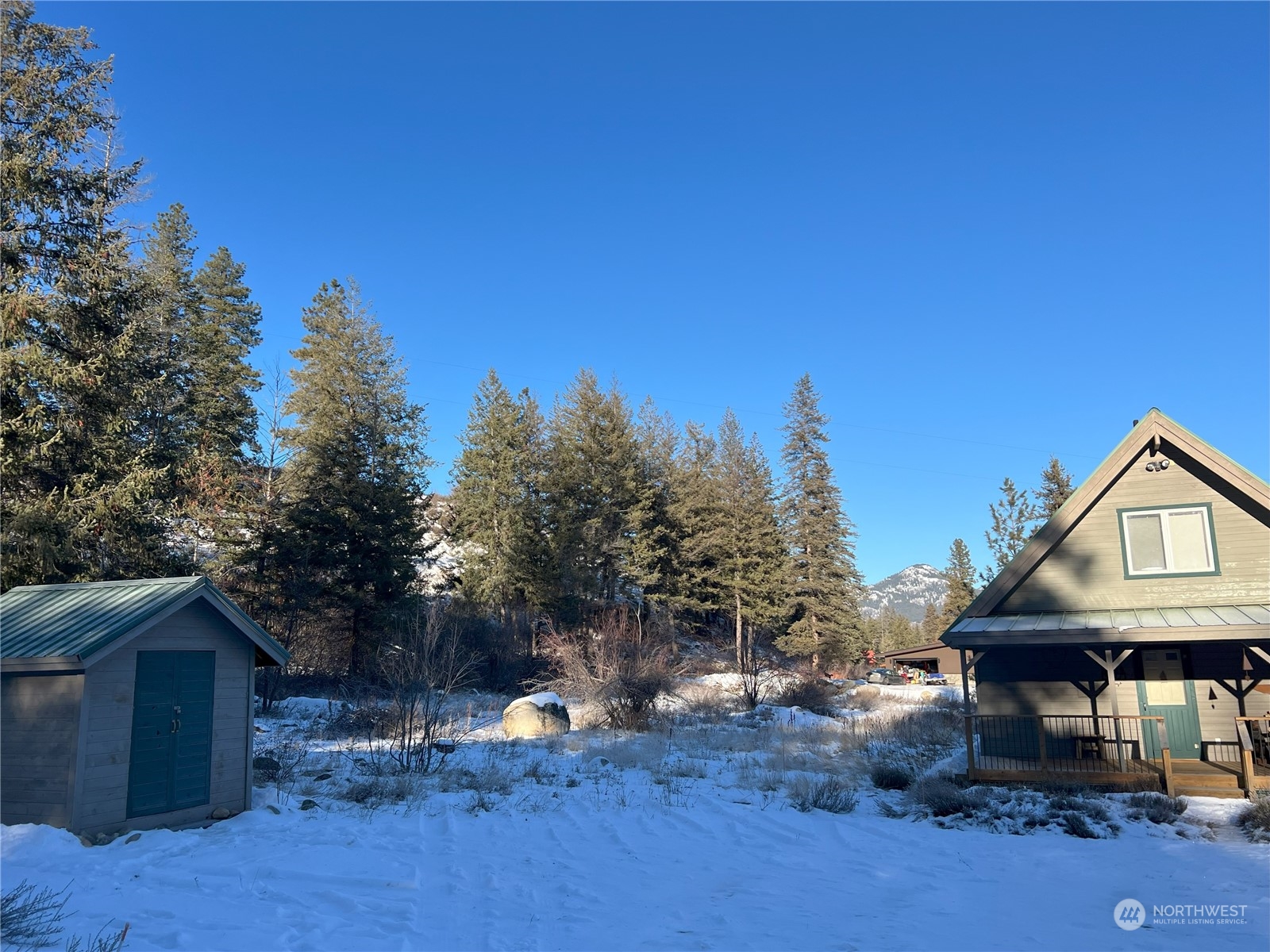 30 Left Fork Wolf Creek Road Winthrop, WA 98862 - Photo 3 of 40 a view of house with outdoor space and sitting area