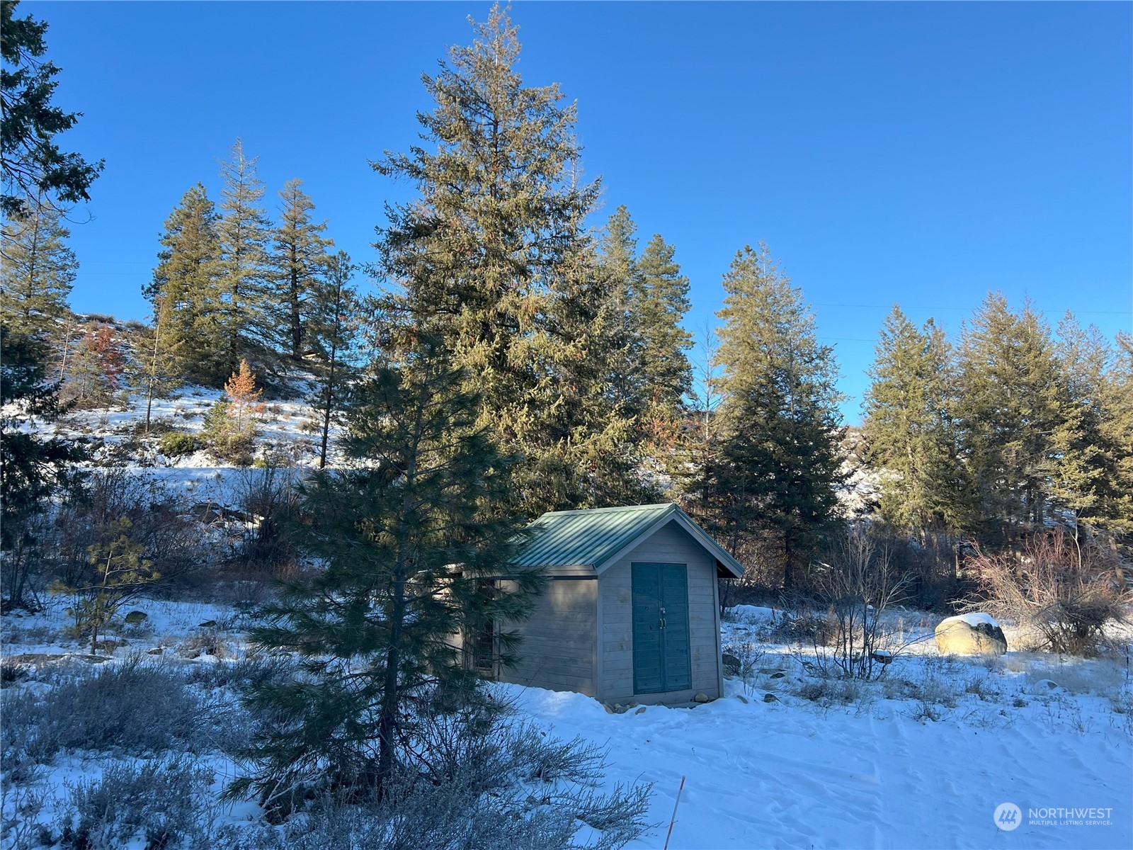30 Left Fork Wolf Creek Road Winthrop, WA 98862 - Photo 33 of 40 a view of a house with a yard