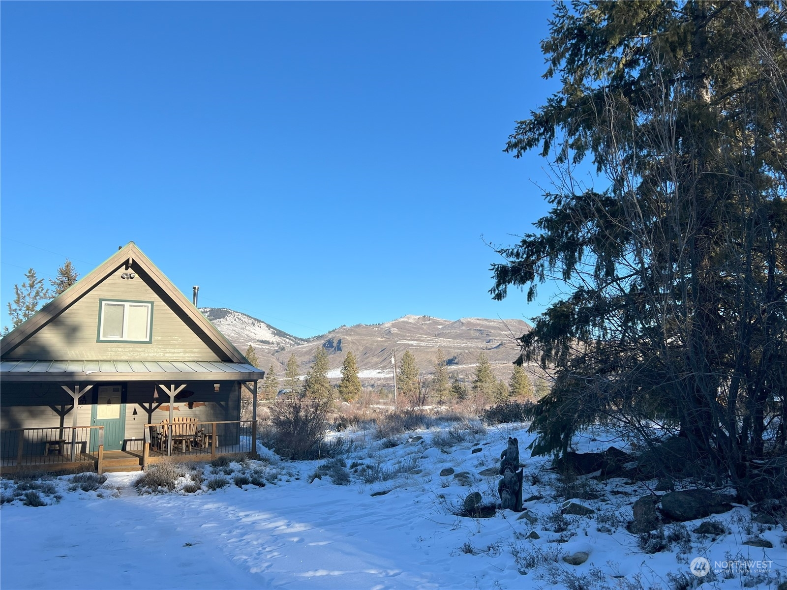30 Left Fork Wolf Creek Road Winthrop, WA 98862 - Photo 4 of 40 a front view of a house with a yard