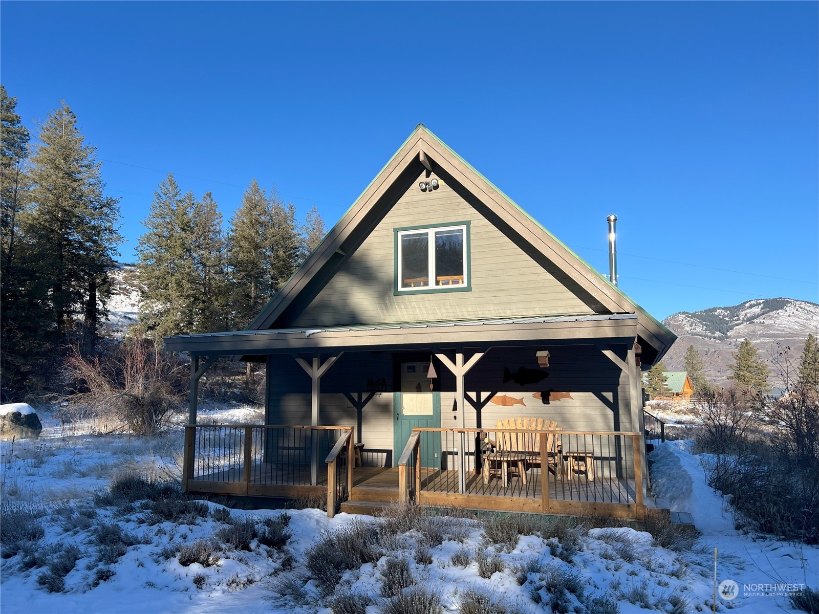 30 Left Fork Wolf Creek Road Winthrop, WA 98862 - Photo 5 of 40 a front view of a house with garden