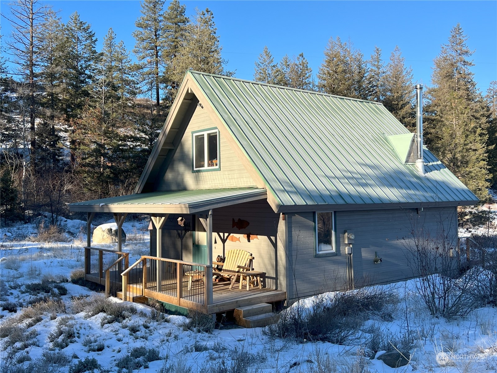 30 Left Fork Wolf Creek Road Winthrop, WA 98862 - Photo 6 of 40 a front view of a house with garden