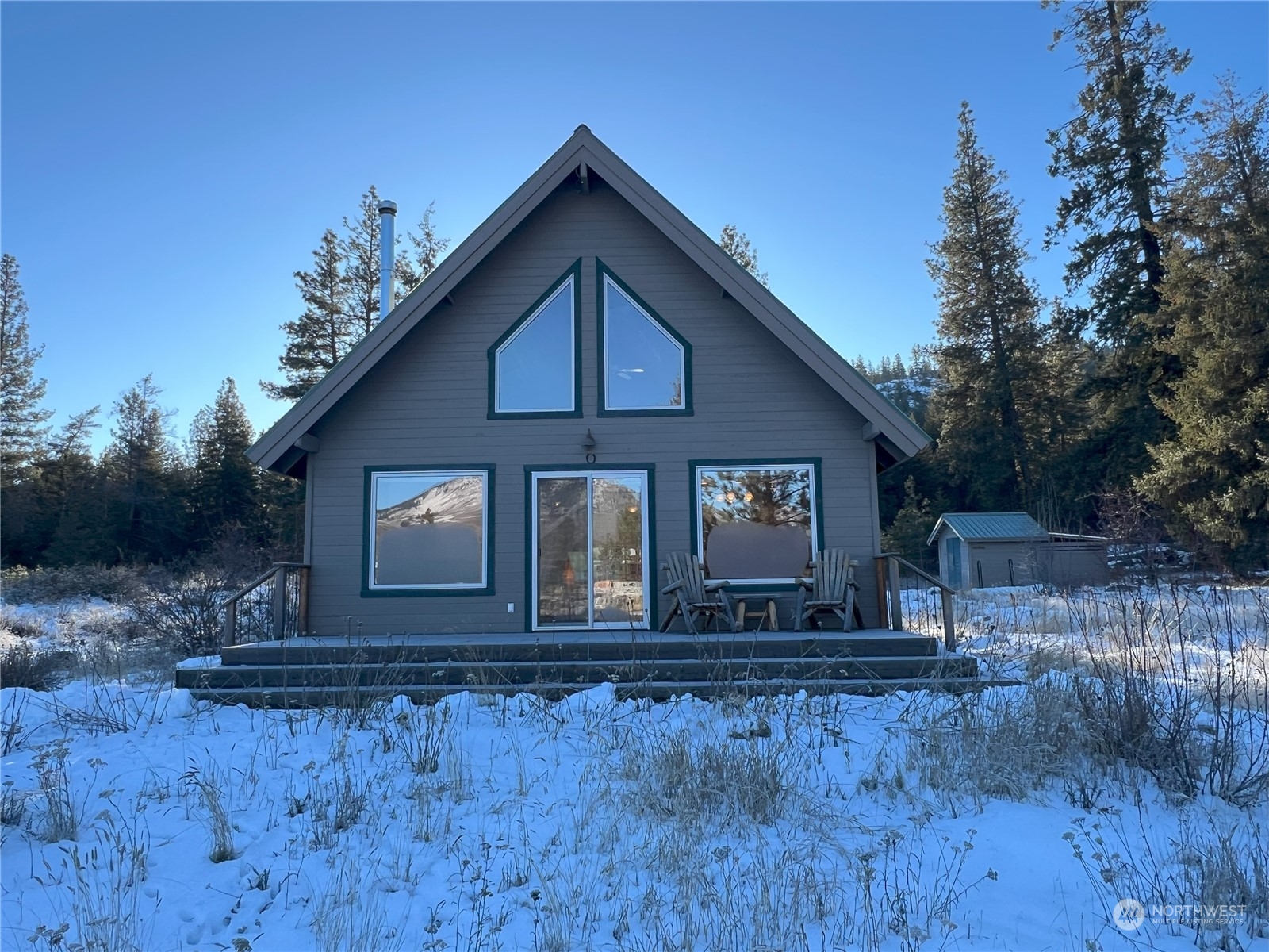 30 Left Fork Wolf Creek Road Winthrop, WA 98862 - Photo 7 of 40 a front view of a house with a yard