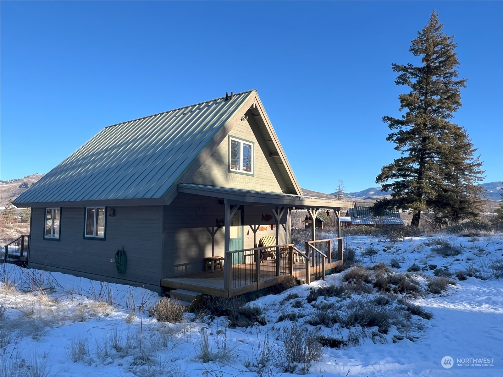 30 Left Fork Wolf Creek Road Winthrop, WA 98862 - Photo 8 of 40 a front view of a house with garden