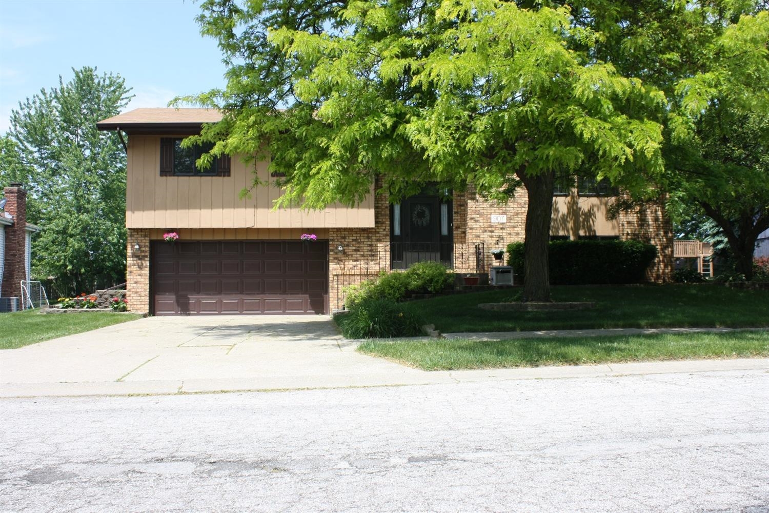 907 Old Beach Road Dyer, IN 46311 - Photo 1 of 10 a front view of a house with a garden