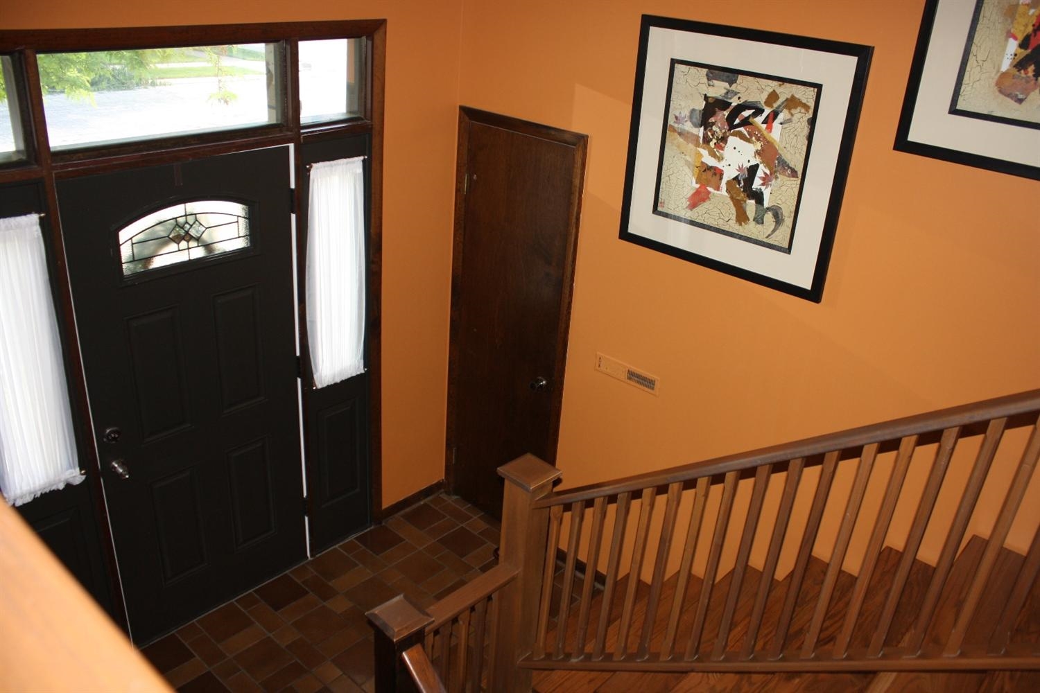 907 Old Beach Road Dyer, IN 46311 - Photo 8 of 10 a view of a hallway with wooden floor and windows