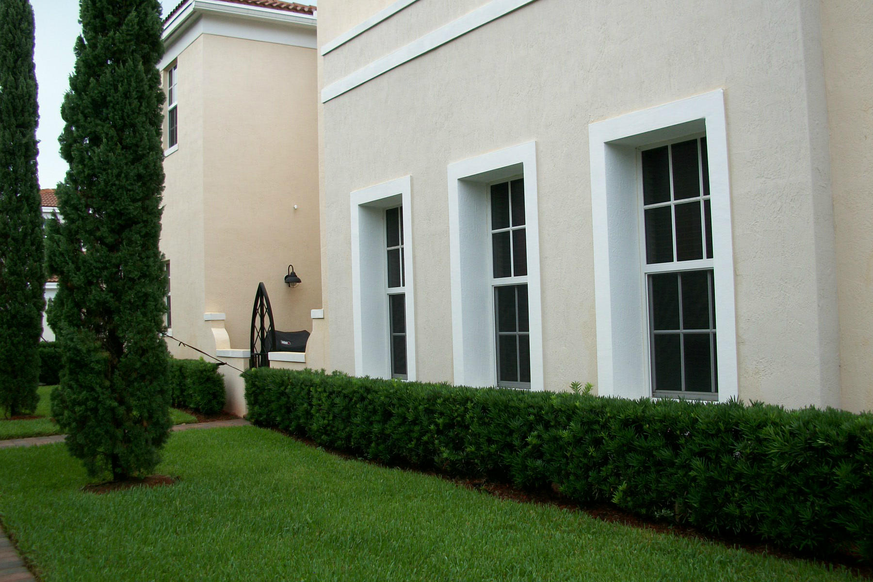 822 Northwest 82nd Place Boca Raton, FL 33487 - Photo 18 of 22 a view of backyard with potted plants and large tree