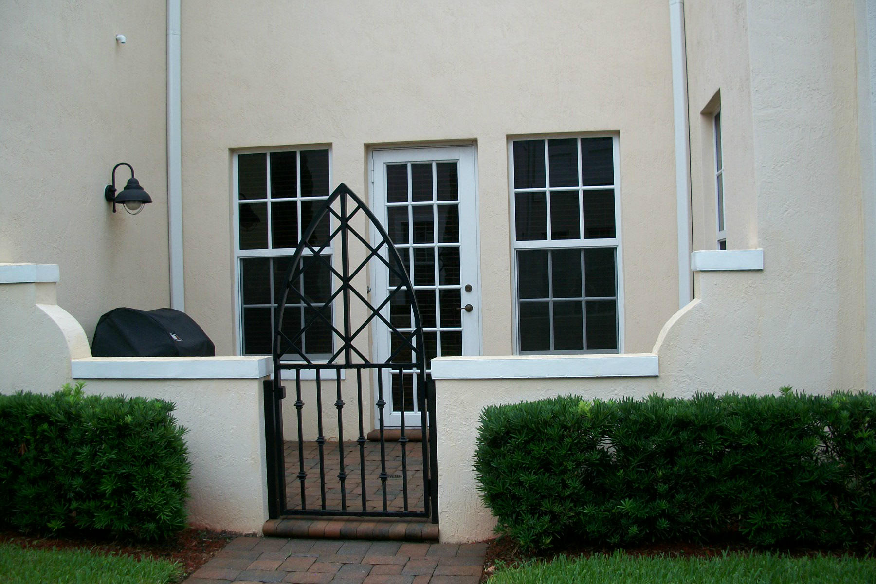 822 Northwest 82nd Place Boca Raton, FL 33487 - Photo 19 of 22 a view of front door and small yard