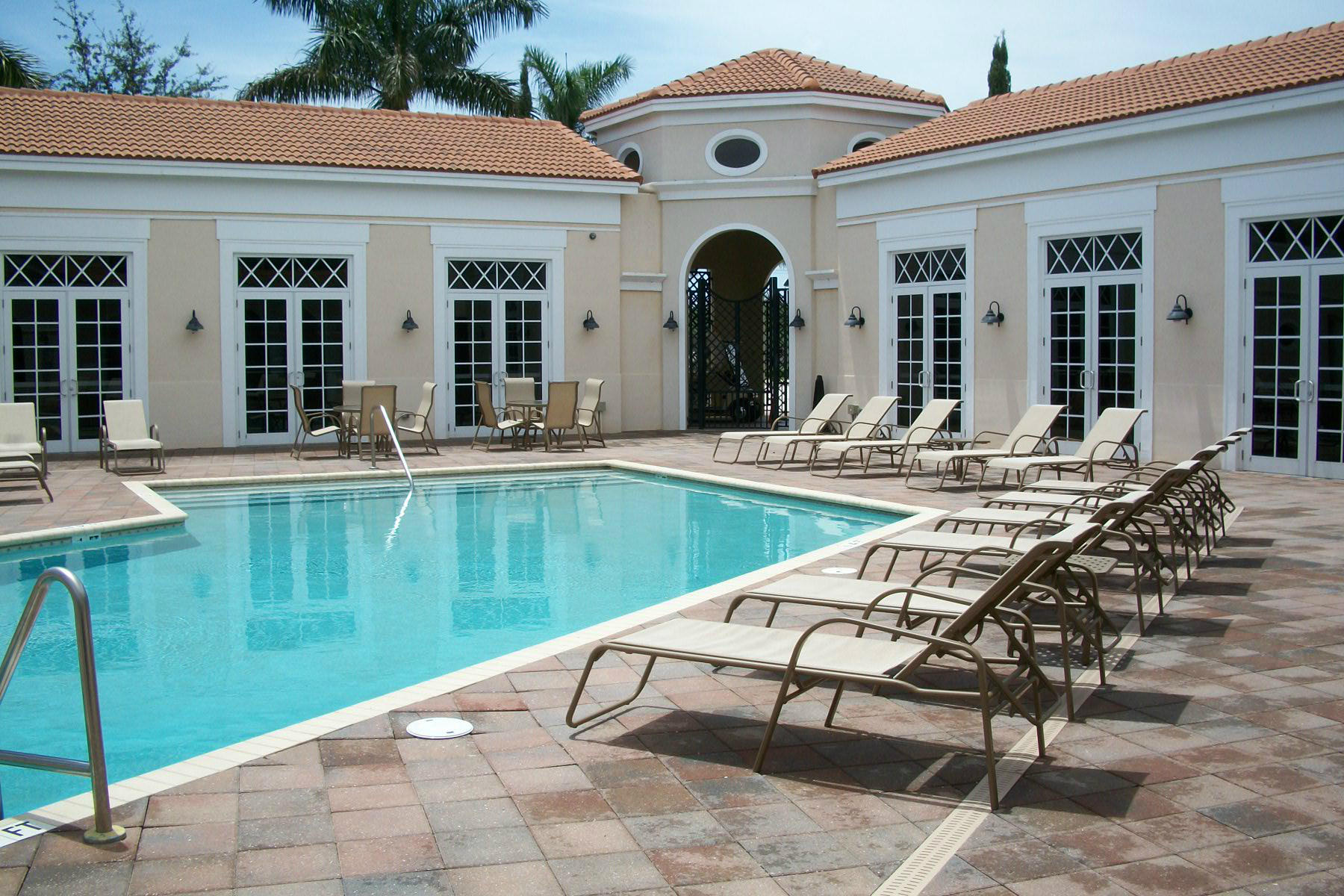 822 Northwest 82nd Place Boca Raton, FL 33487 - Photo 21 of 22 a swimming pool with outdoor seating and yard