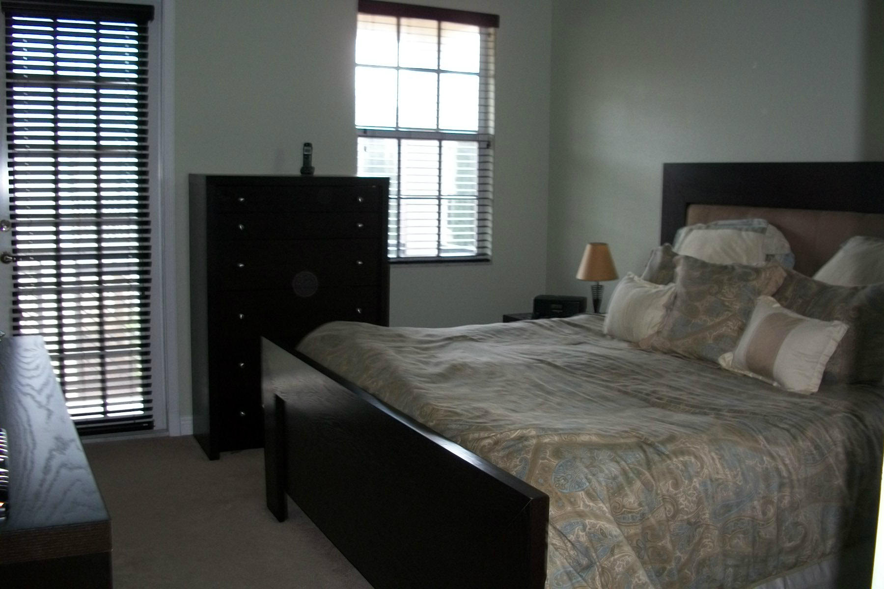 822 Northwest 82nd Place Boca Raton, FL 33487 - Photo 9 of 22 a bedroom with a bed and a window