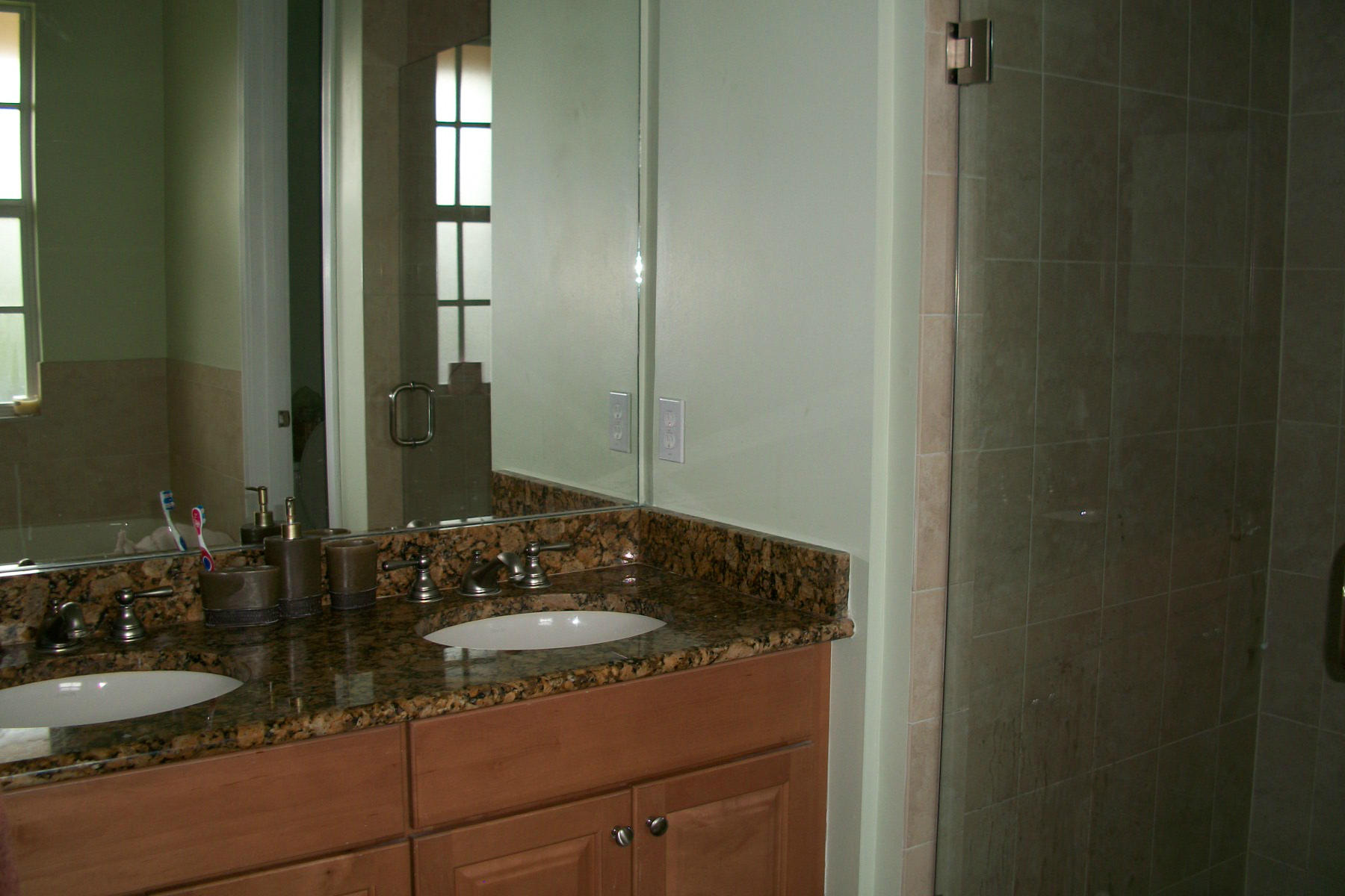 822 Northwest 82nd Place Boca Raton, FL 33487 - Photo 10 of 22 a bathroom with a granite countertop sink and a mirror