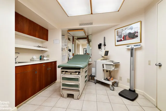 a room with wooden floor and furniture