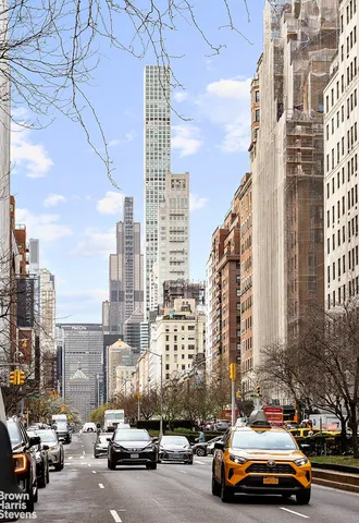 a street sign on a brick wall