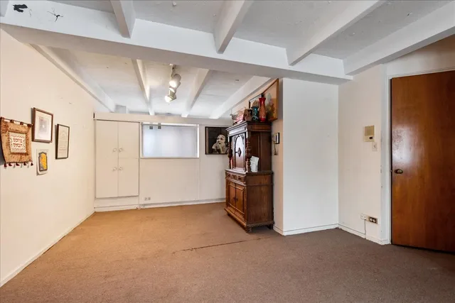 a view of a room with closet and windows