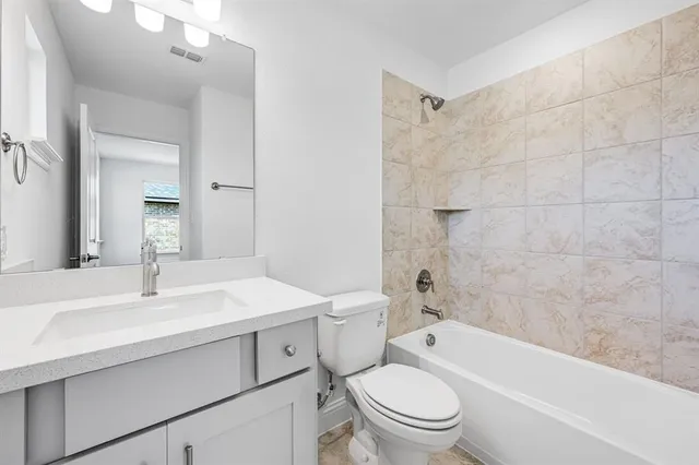 a bathroom with a double vanity sink a mirror and shower