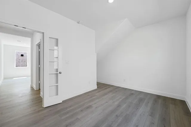 a view of a backyard with wooden fence