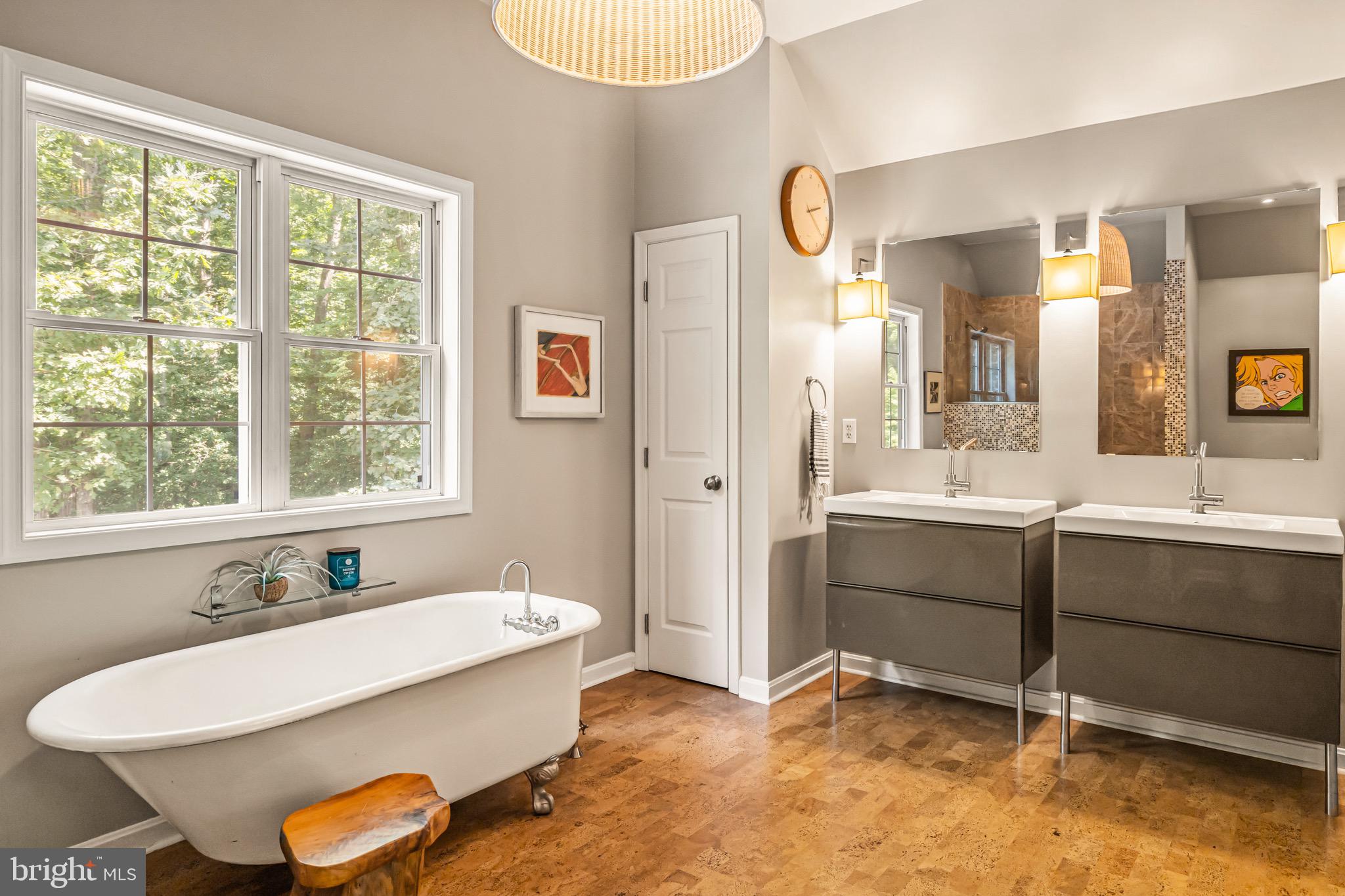 21897 Lavender Lane Lewes, DE 19958 - Photo 31 of 71 A clawfoot soaking tub and dual vanities