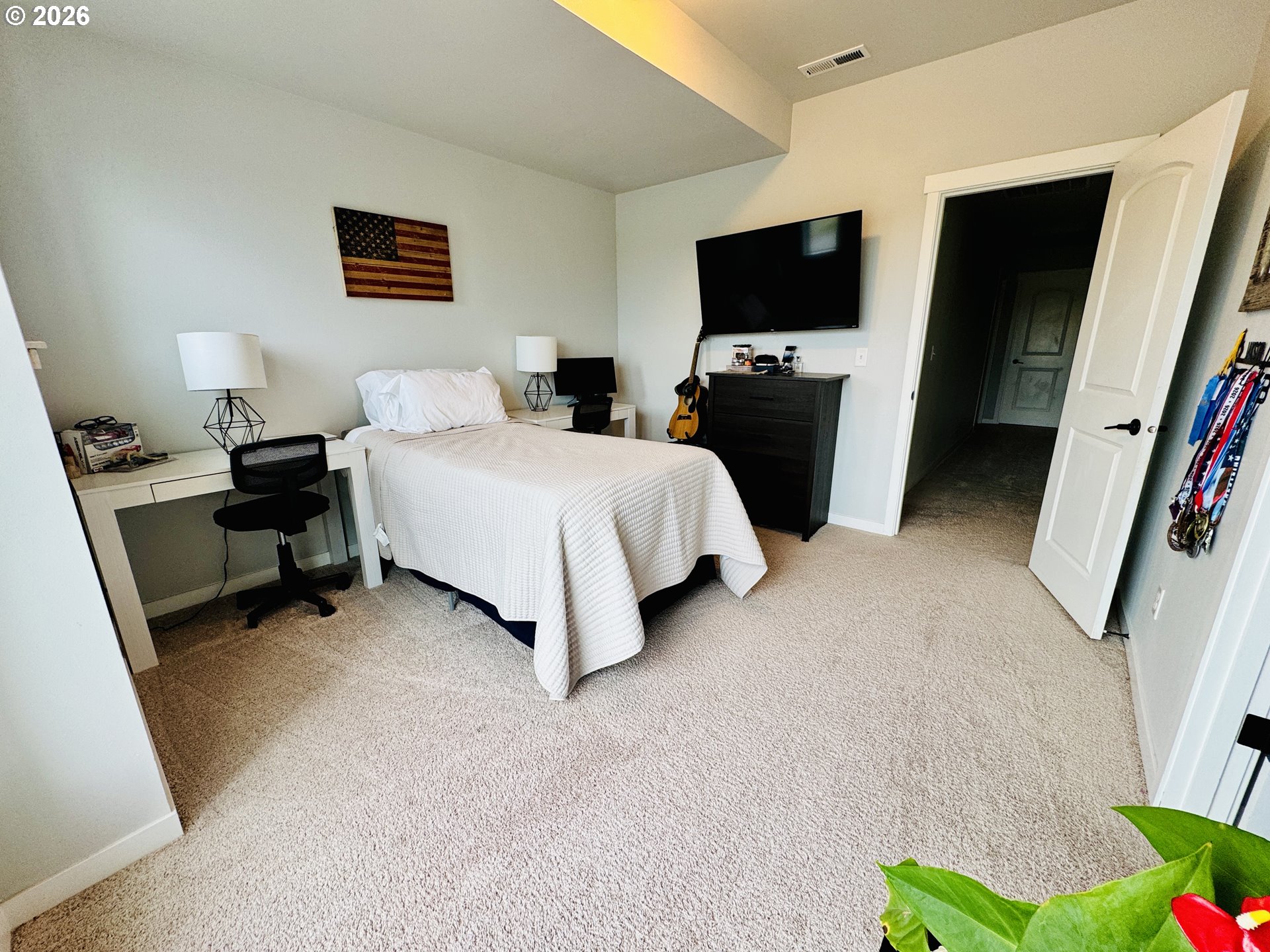 74969 Washington Lane Irrigon, OR 97844 - Photo 23 of 33 a bedroom with bed and a flat tv screen on dresser