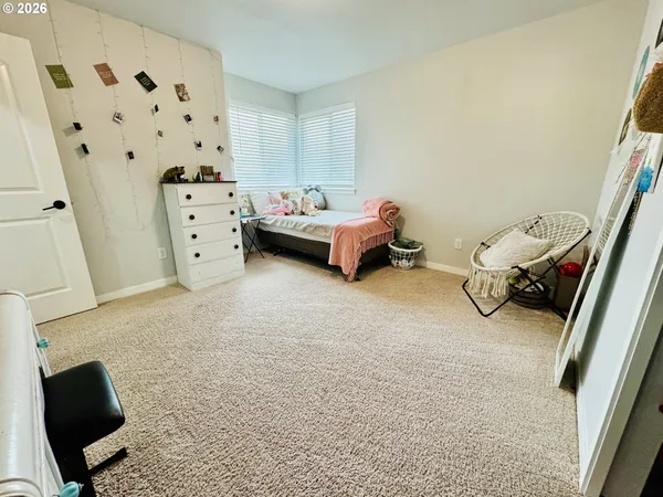 a view of a livingroom with furniture and windows
