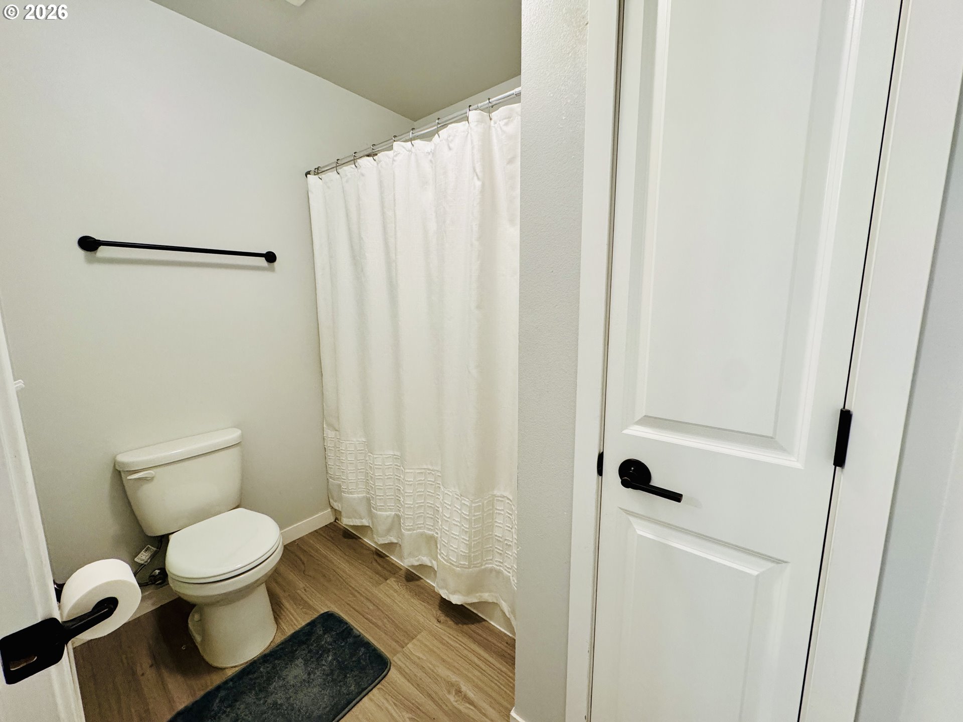 74969 Washington Lane Irrigon, OR 97844 - Photo 28 of 33 a white toilet sitting next to a shower curtain