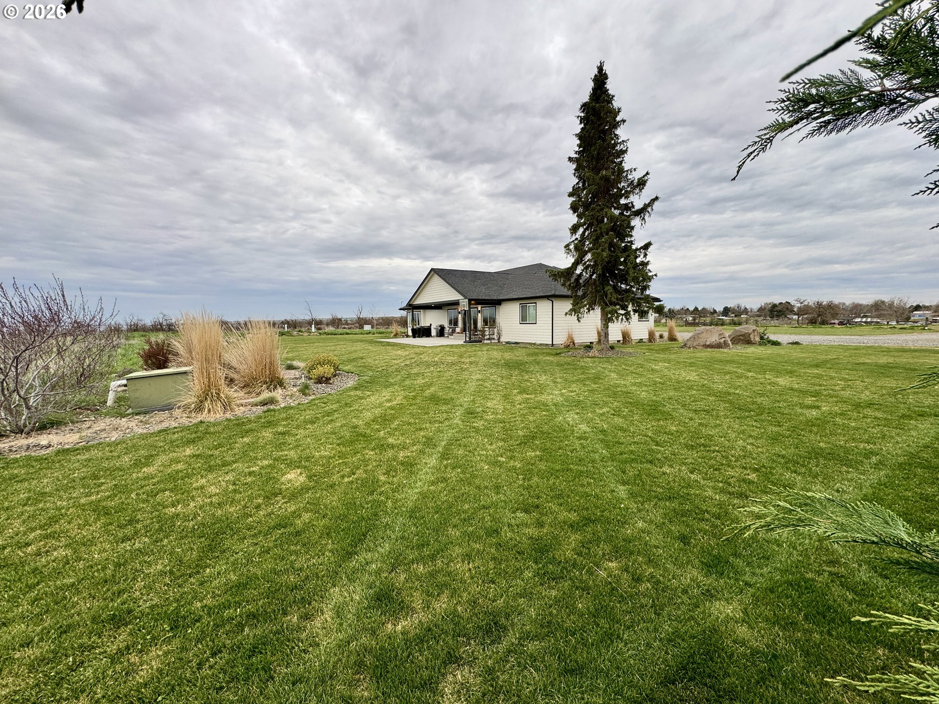 74969 Washington Lane Irrigon, OR 97844 - Photo 3 of 33 a view of a houses with yard and lake view
