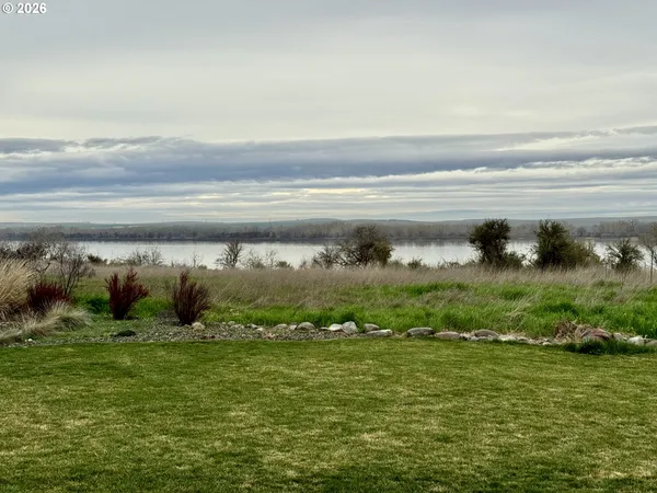 a living room with furniture and dining table