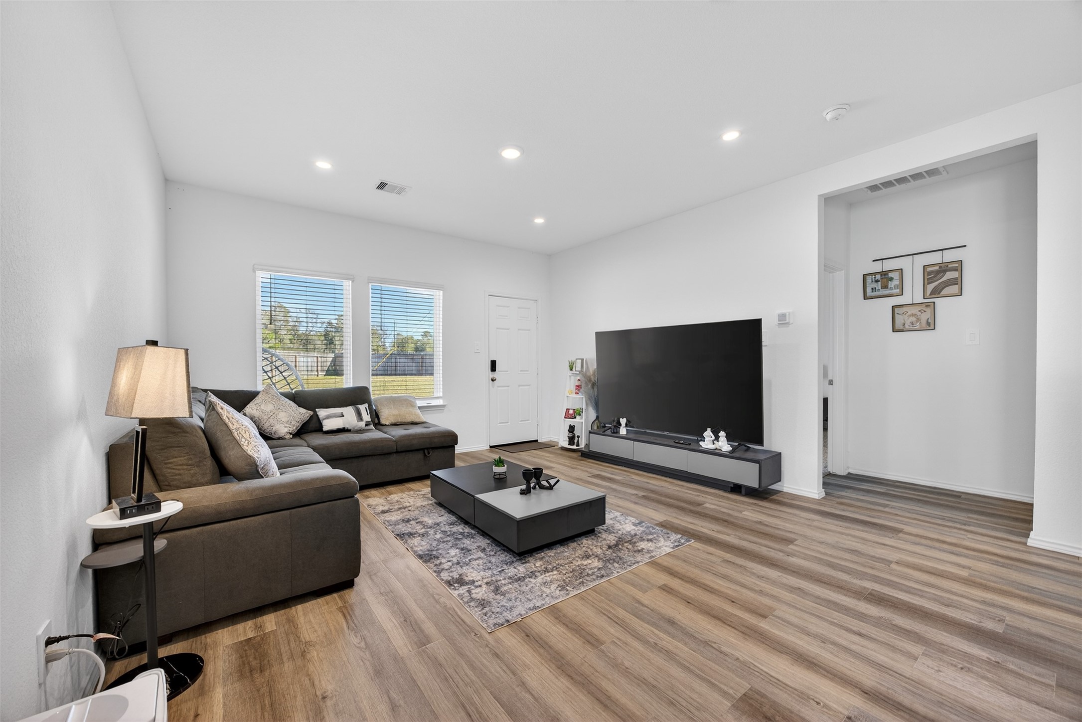 1702 Legacy Hills Drive Houston, TX 77067 - Photo 11 of 43 a living room with furniture and a flat screen tv