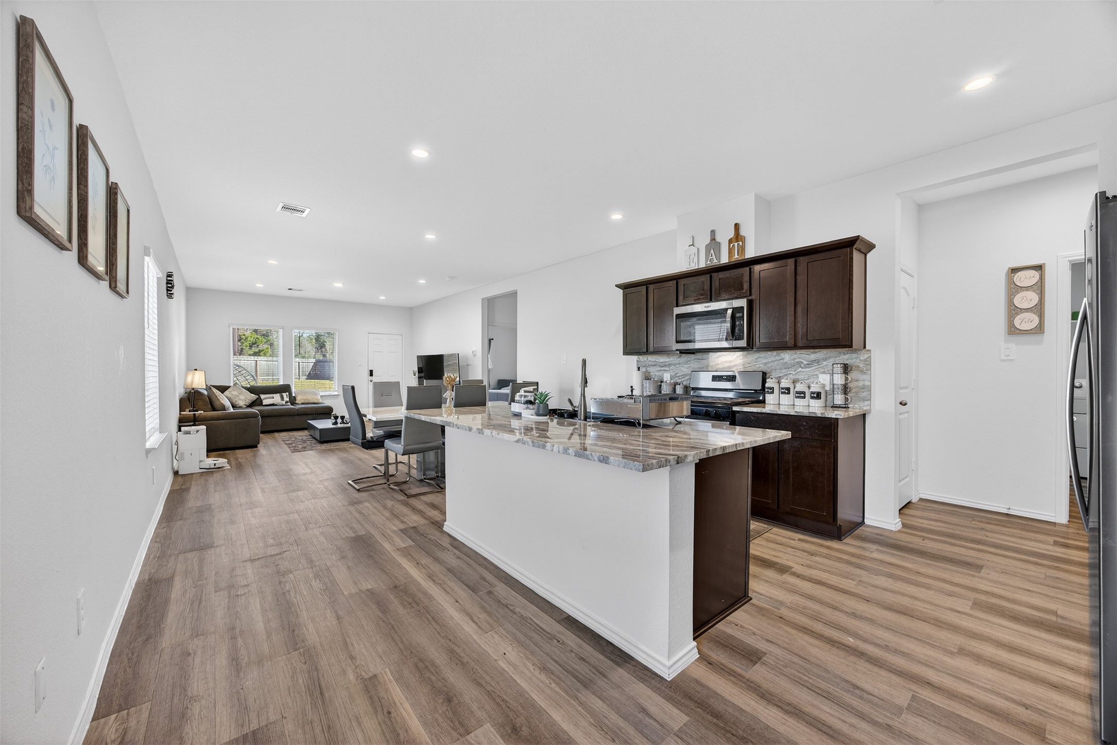 1702 Legacy Hills Drive Houston, TX 77067 - Photo 12 of 43 a kitchen with sink a counter top space stainless steel appliances and cabinets