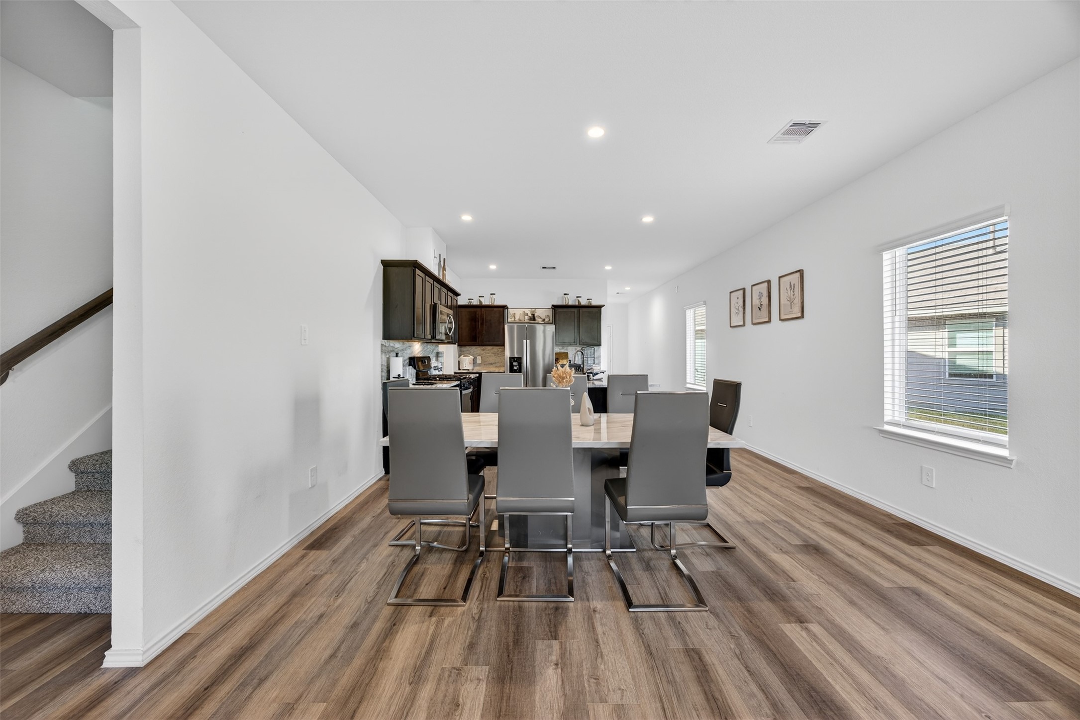 1702 Legacy Hills Drive Houston, TX 77067 - Photo 18 of 43 a view of a dining room with furniture window and wooden floor
