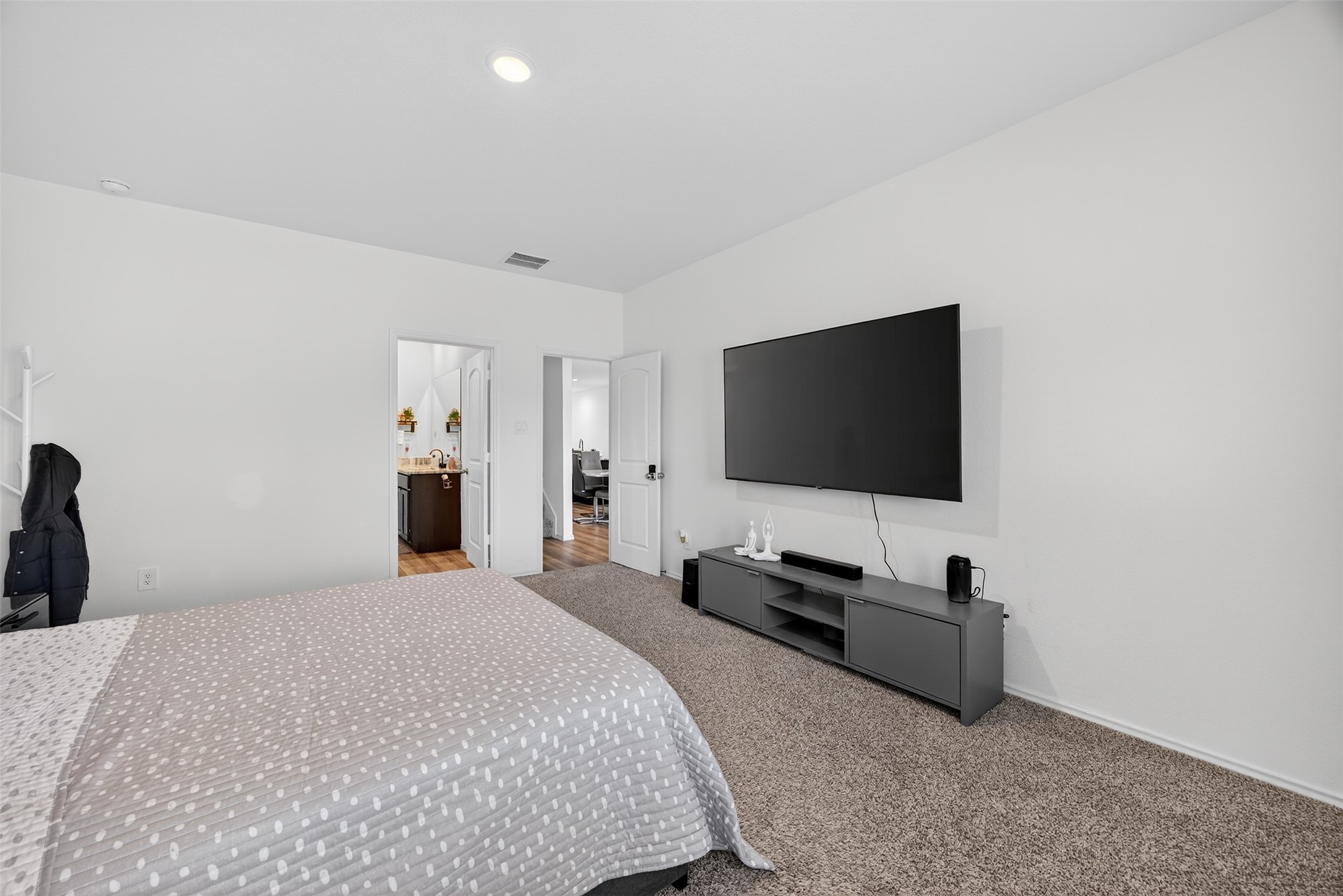 1702 Legacy Hills Drive Houston, TX 77067 - Photo 20 of 43 a bedroom with a bed and a flat screen tv