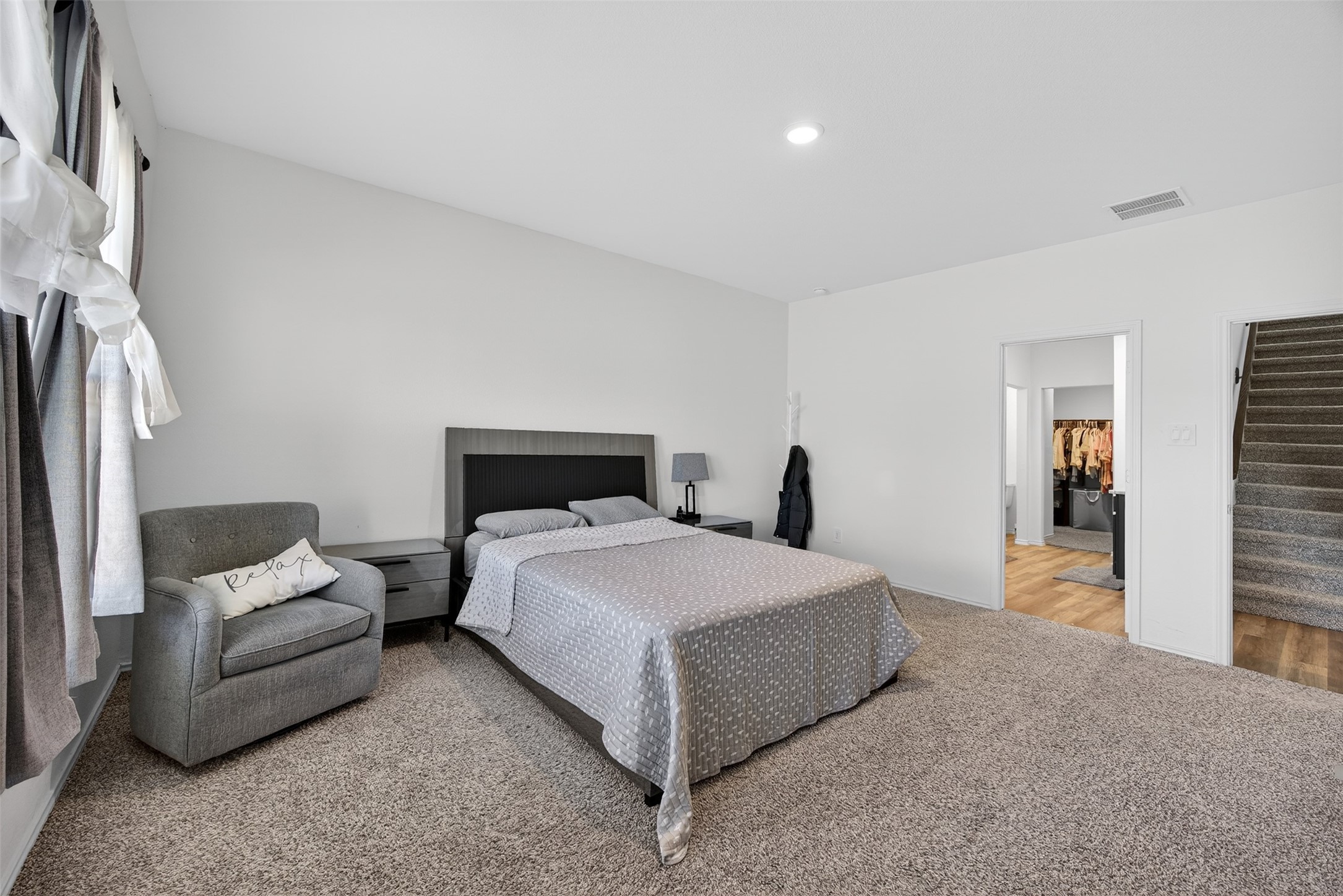 1702 Legacy Hills Drive Houston, TX 77067 - Photo 21 of 43 a bedroom with a bed and lamp