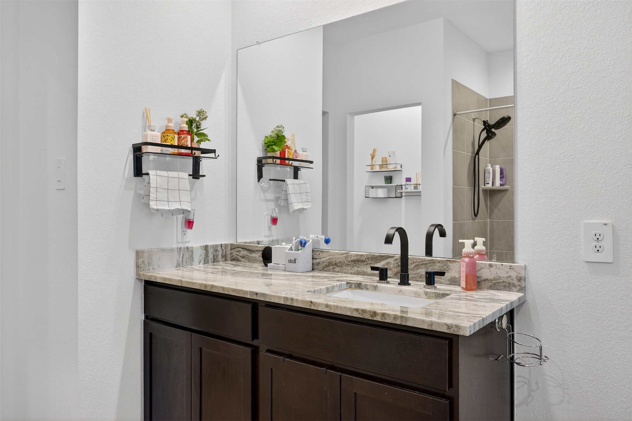 1702 Legacy Hills Drive Houston, TX 77067 - Photo 23 of 43 a bathroom with a granite countertop sink and a mirror