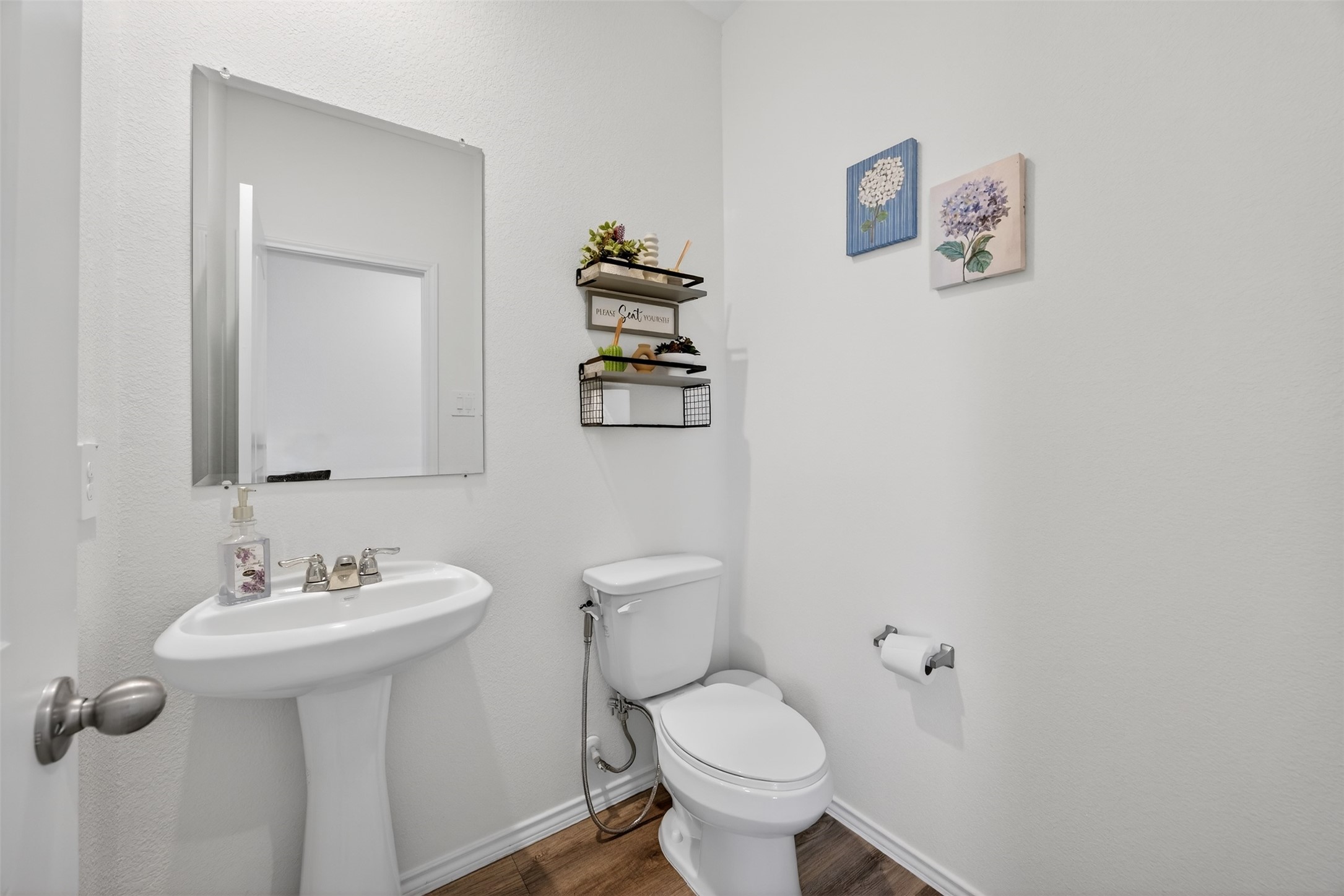 1702 Legacy Hills Drive Houston, TX 77067 - Photo 26 of 43 a bathroom with a sink toilet and mirror