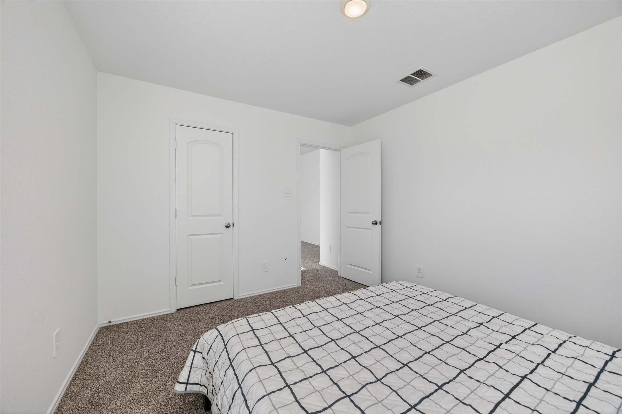 1702 Legacy Hills Drive Houston, TX 77067 - Photo 30 of 43 a bedroom with a bed and a window