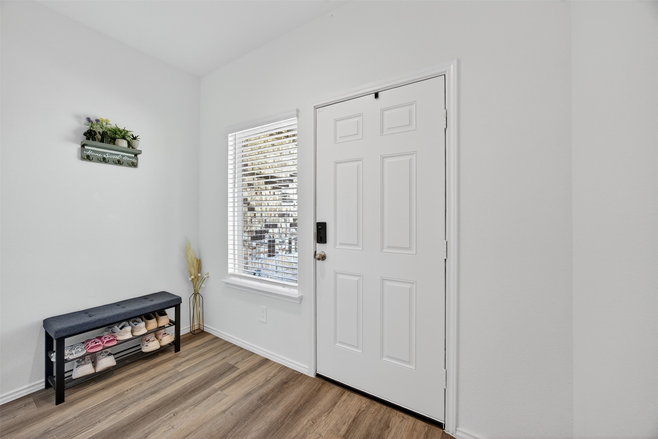 1702 Legacy Hills Drive Houston, TX 77067 - Photo 8 of 43 a view of an empty room with wooden floor and a window
