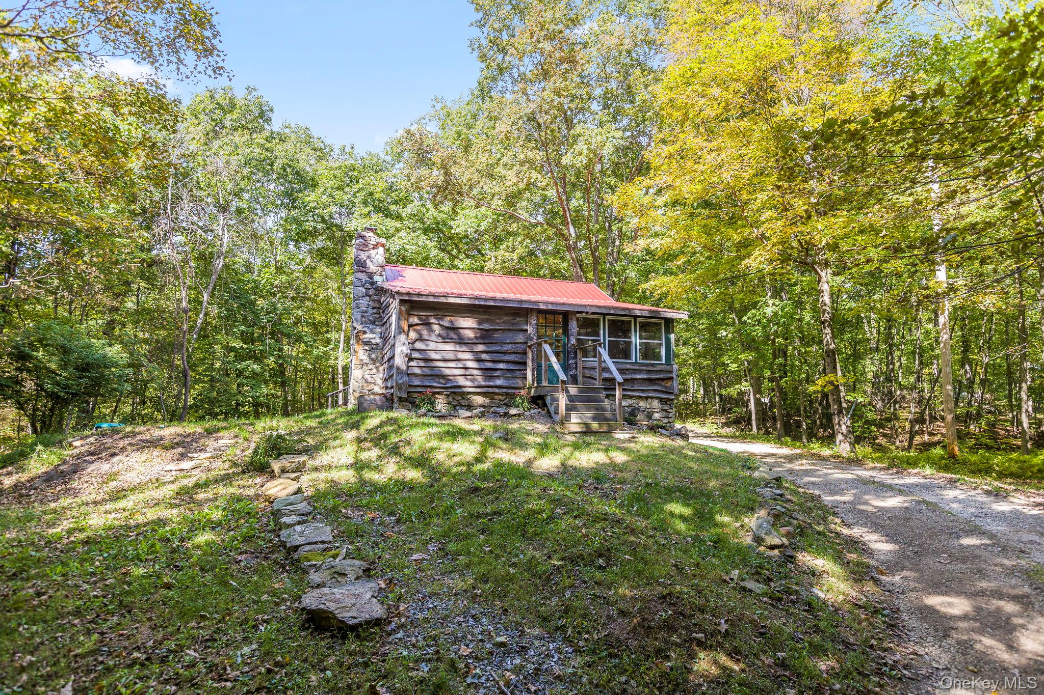 23 Ramphal Drive Holmes, NY 12531 - Photo 1 of 1 a backyard of a house with table and chairs