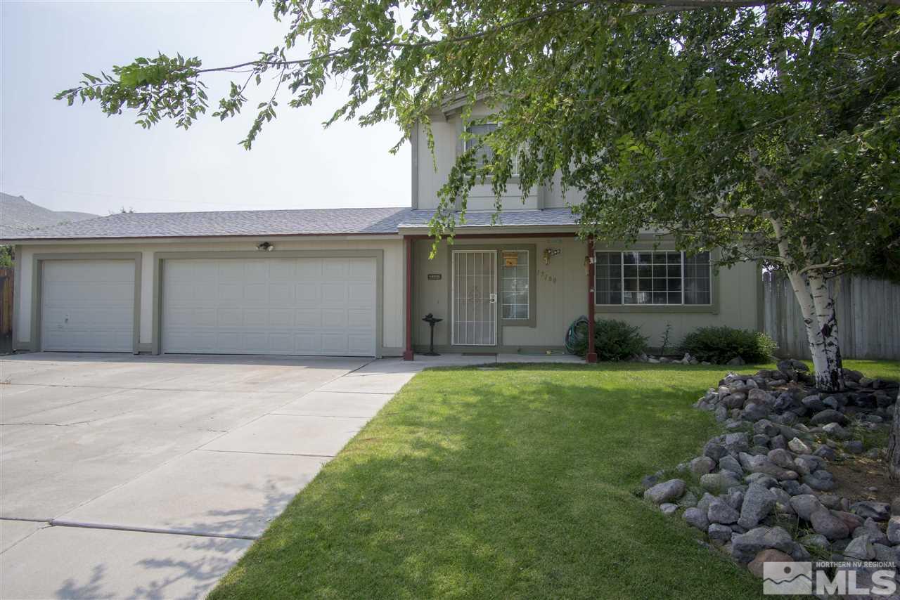 17180 Touraco Street Reno, NV 89508 - Photo 1 of 12 a front view of a house with garden