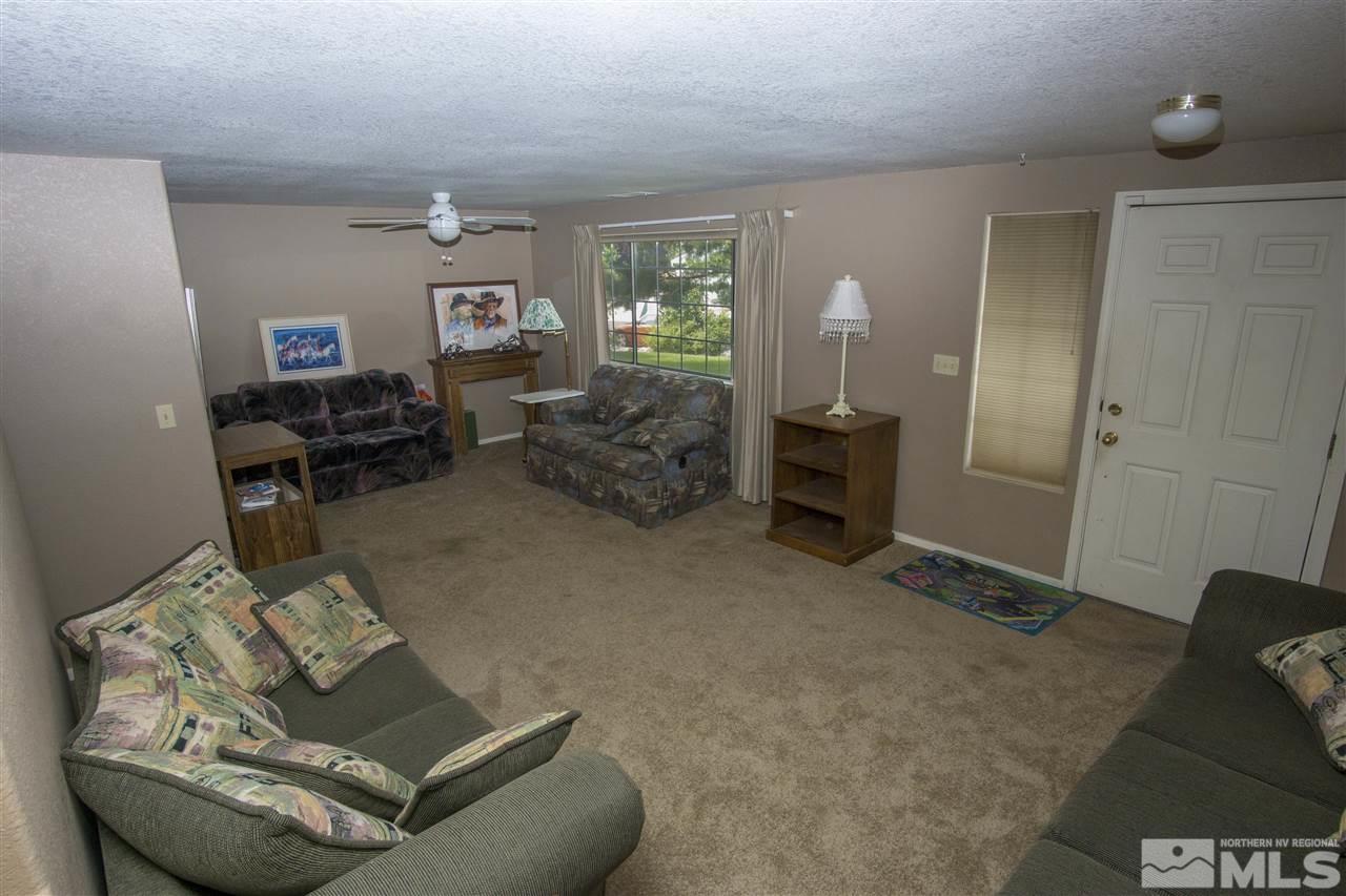 17180 Touraco Street Reno, NV 89508 - Photo 3 of 12 a living room with furniture and a window