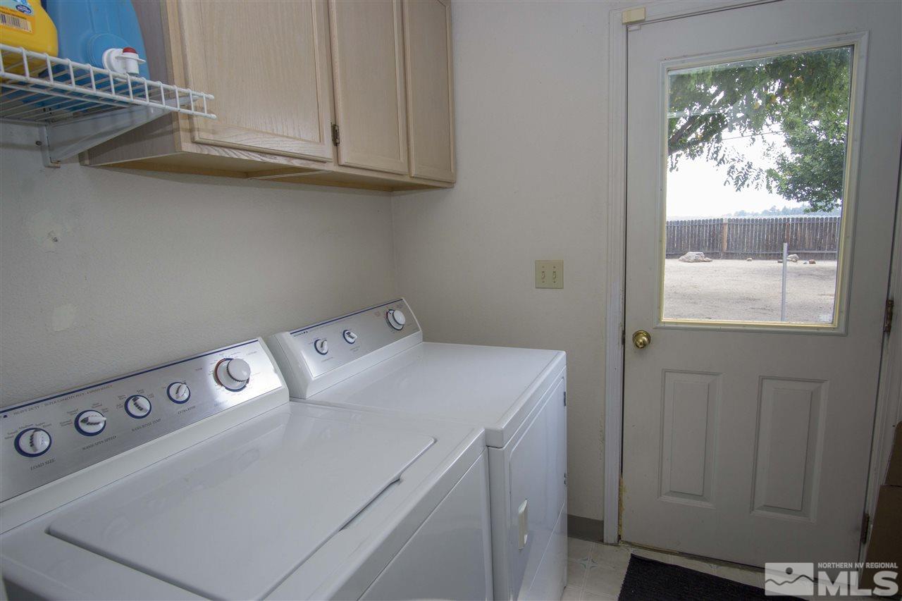 17180 Touraco Street Reno, NV 89508 - Photo 7 of 12 a utility room with dryer and washer