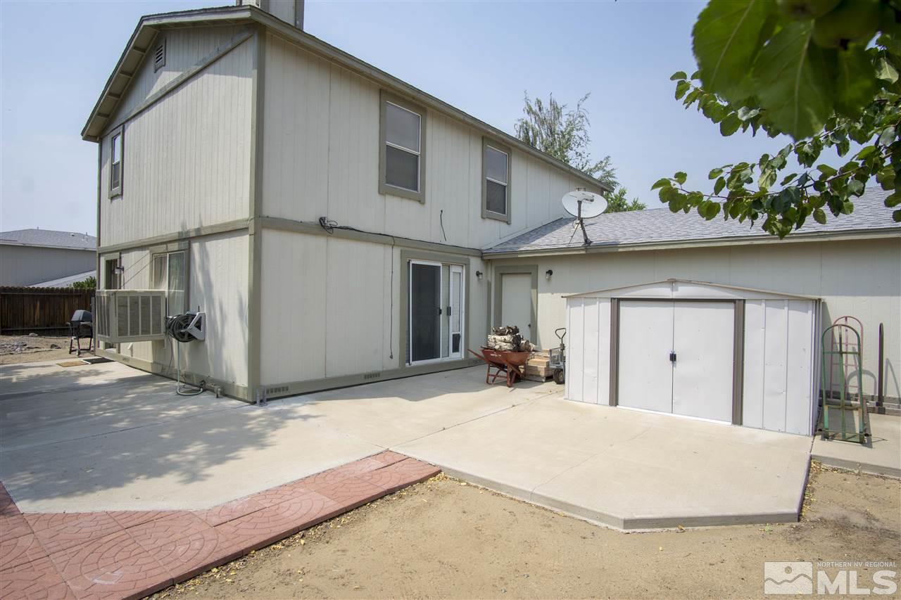17180 Touraco Street Reno, NV 89508 - Photo 8 of 12 a view of a house with a patio