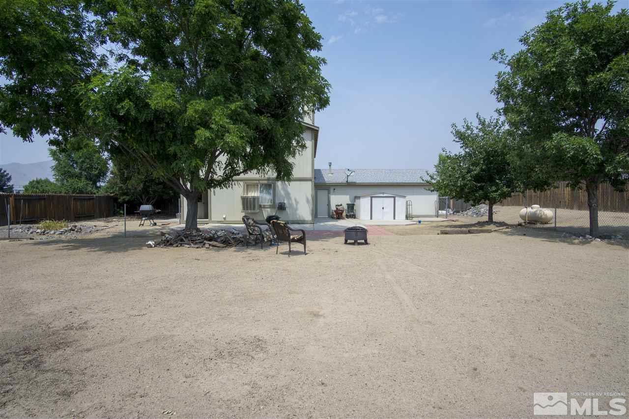 17180 Touraco Street Reno, NV 89508 - Photo 9 of 12 a view of the house with a yard