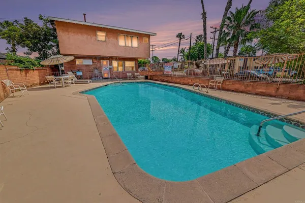 a view of a swimming pool with a lounge chairs