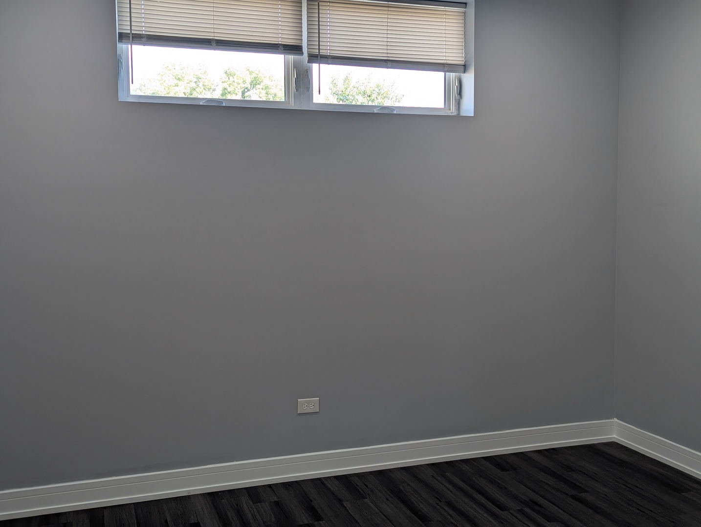 3925 South Indiana Avenue, Unit 3 Chicago, IL 60653 - Photo 11 of 11 a view of a small space with wooden floor and a window